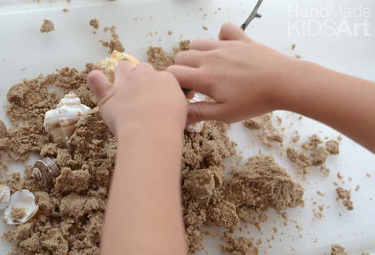 mermaid castle sand hands